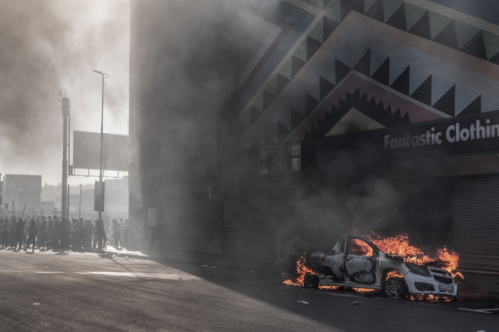A car is set alight after clashes erupted between protesters and foreign nationals in Durban on October 8, 2026. — AFP pic
