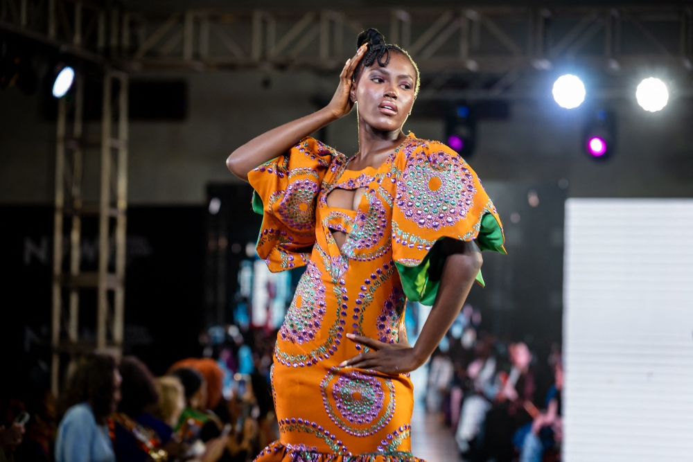 A model presents a creation by Wosstika's Design, during the Nigeria fashion Week 2026 at Soul Lounge Resort in Abuja, on October 2, 2026. Nigerian models donned outfits of seemingly impossible amounts of fabric folded and molded into massive silhouettes, or overlapping in shingled, feather-like patterns.The colourful, detailed textiles evoked Carnival -- both Nigeria's own, in the southeastern city of Calabar, or that of Rio de Janeiro fame -- but were in fact splashing down a runway in Abuja, better known for being the sleepy seat of government than for avant-guard couture.Nigeria Fashion Week, which wraps Sunday, decamped from Lagos this year, trading the mega-city of more than 20 million -- the nation's economic and artistic mecca -- for the centrally planned administrative centre, which nonetheless has developed its own, smaller creative scene. — AFP pic