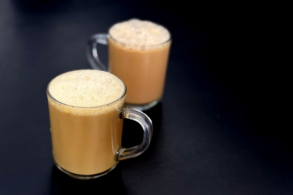 Frothy Nescafé 'tarik' and 'teh tarik'. 