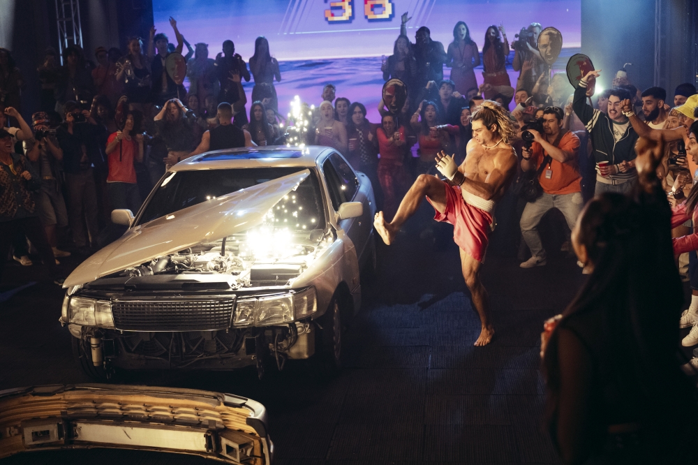 Noah Centineo as Ken Masters in a scene inspired by the iconic car-smashing bonus stage from the ‘Street Fighter’ video games. — Picture courtesy of UIP International
