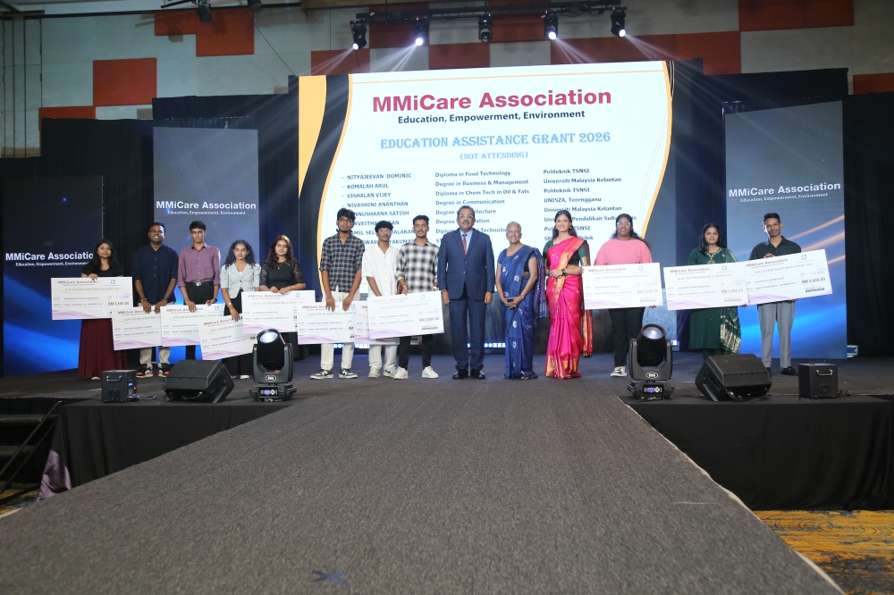 Sentosa assemblyman Dr Gunarajah George (centre) with recipients of the MMICARE Education Assistance Grant 2026 at the Miss Malaysia Indian Global 2026 grand final. Each of the 19 grants is worth RM3,600. — Picture courtesy of MMIGLOBAL