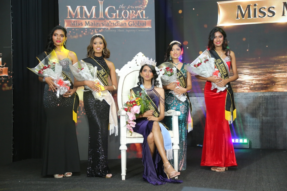Miss Malaysia Indian Global 2026 Kavitha Malathy (seated) with (from left) third runner-up Sharon Ganash, second runner-up Yashwini Ravindranath, first runner-up Shajana Vincent and fourth runner-up Ashsweta Muniandy at the grand final. — Picture courtesy of MMIGLOBAL