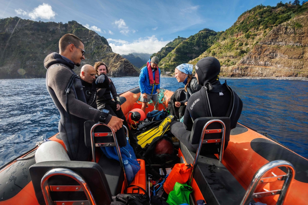 (From left) Marine biologists Gustavo Sousa, David Jacinto, David Milla Figueras, and Eva Iniguez, dive safety officer Cristiano Samagaio, and research technician Laura Piazzese prepare for a dive aboard an inflatable motorboat off the coast of Madeira on October 11, 2026, during the ‘Madeira Ocean’ scientific expedition. — AFP pic 