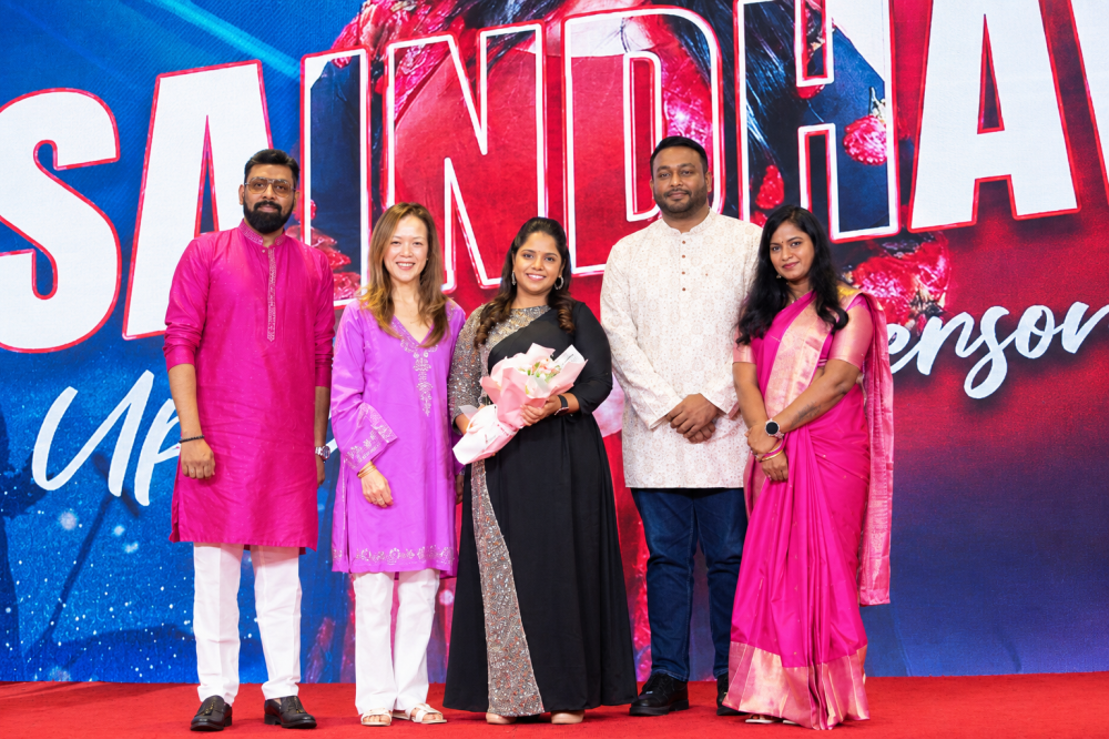 Astro chief content officer Agnes Rozario (second right) and vice-president of Indian content business Prem Anand Rajahram (second left) present singer Saindhavi (centre) with an appreciation gift at the Astro Deepavali Open House 2026 at the Jasmine Signature Ballroom in Petaling Jaya, October 17, 2026. 