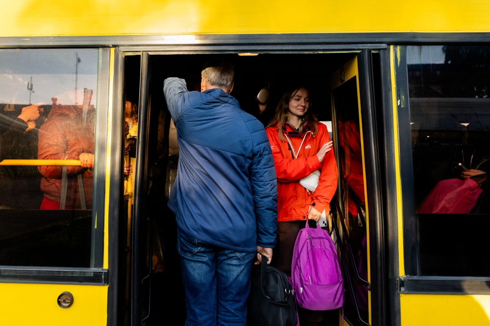 Anastasiia Zhmutska, 44 years old, stands in a bus on her way home after work, in Kyiv on October 13, 2026, amid the Russian invasion of Ukraine. — AFP pic 
