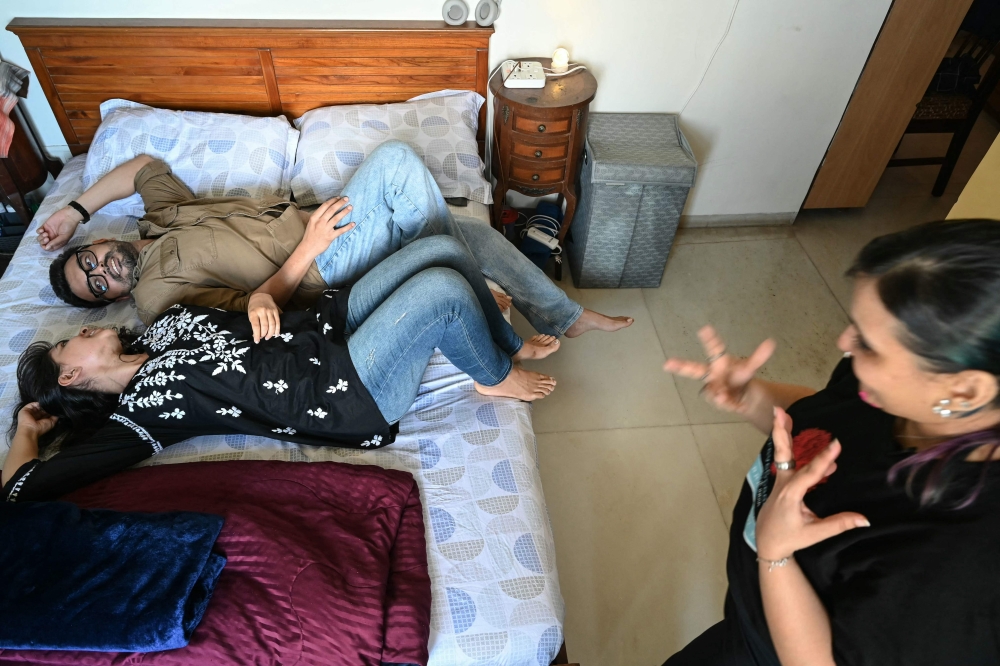 This photograph taken on September 16, 2026 shows intimacy director and BraveSpaces Creative India founder Neha Vyaso (right) conducting a mock intimacy workshop with actors Priti M (centre) and Dev Surana for an upcoming project in Mumbai. — AFP pic