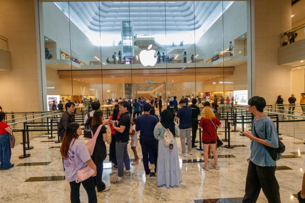 People wait outside the Apple Store at The Exchange TRX in Kuala Lumpur during the iPhone Duo launch on October 23, 2026. — Picture by Raymond Manuel