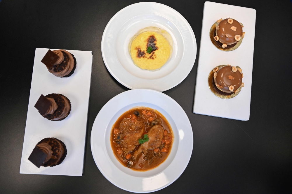 This photograph taken on September 22, 2026 shows French dishes prepared by student chefs at the Ecole Ducasse, a French culinary school in Gurugram. — AFP