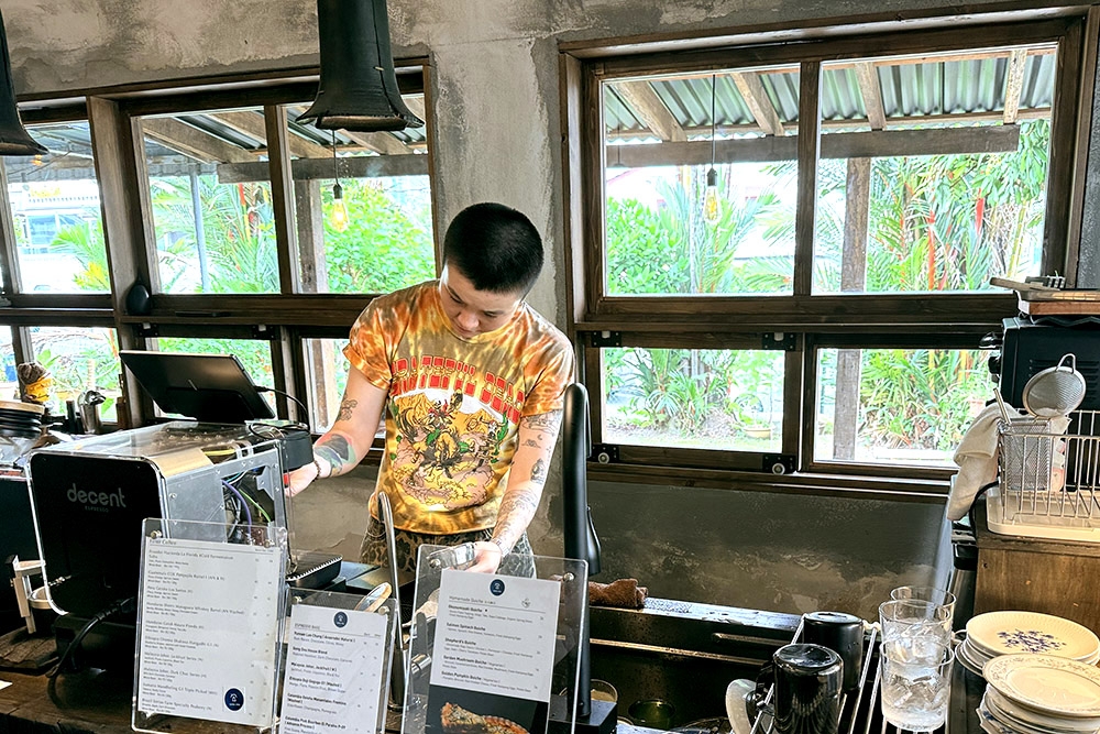 Barista making coffee with direct fire roasted beans. — Picture by CK Lim