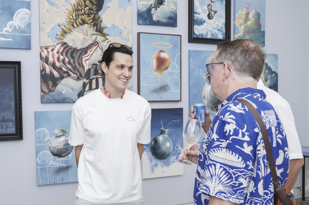 Thomas Powell speaking to visitors at the Up in The Air exhibition. — Picture courtesy of Cultprint 