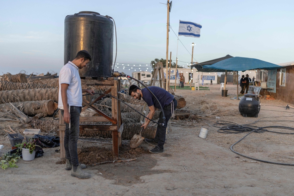 Israeli right-wing members of the Nachala settler organisation are seen at a newly built camp site at a field near the Israeli Kibbutz of Nahal Oz in southern Israel, by the Israel-Gaza border on October 22, 2026.  — AFP pic
