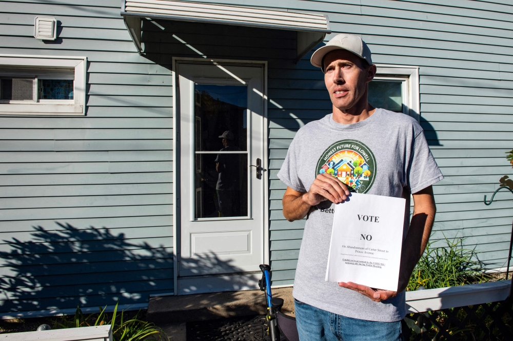 Jake Fortes, a resident whose property sits on the fenceline, less than 100 feet from diesel generators, of the Markley Lowell Data Center, poses for a photo in Lowell, Massachusetts on October 15, 2026. — AFP pic