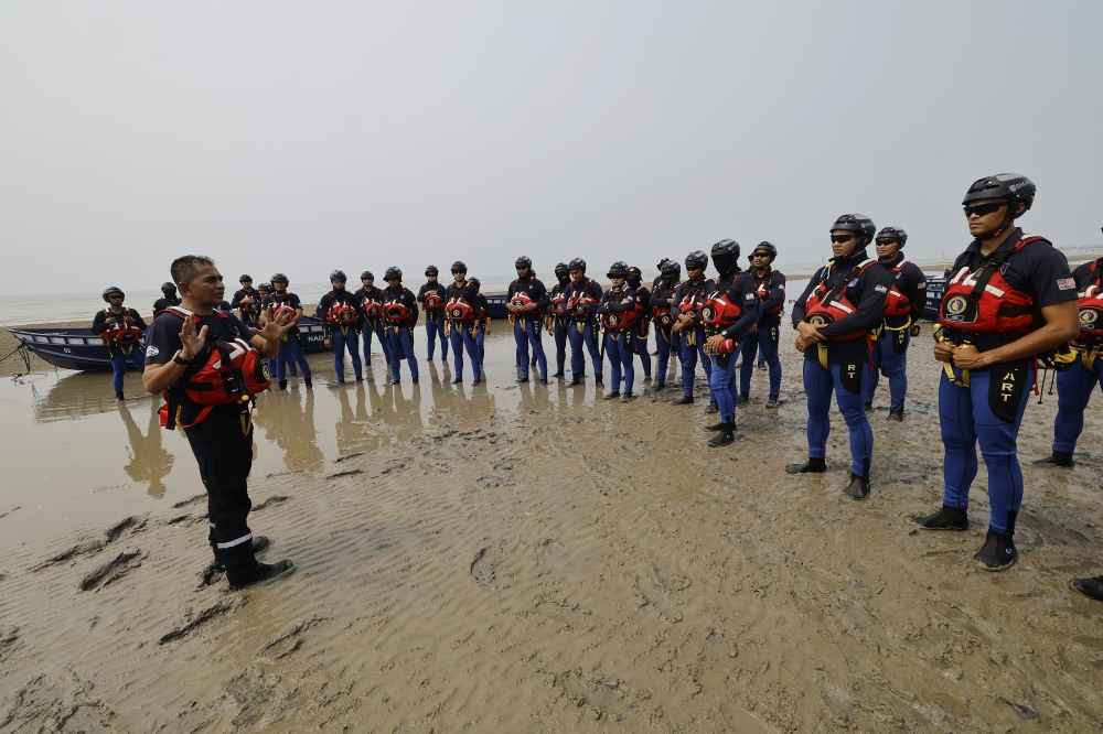Rescue personnel participate in a disaster response exercise as part of preparations for the North-east Monsoon season. — Bernama pic 