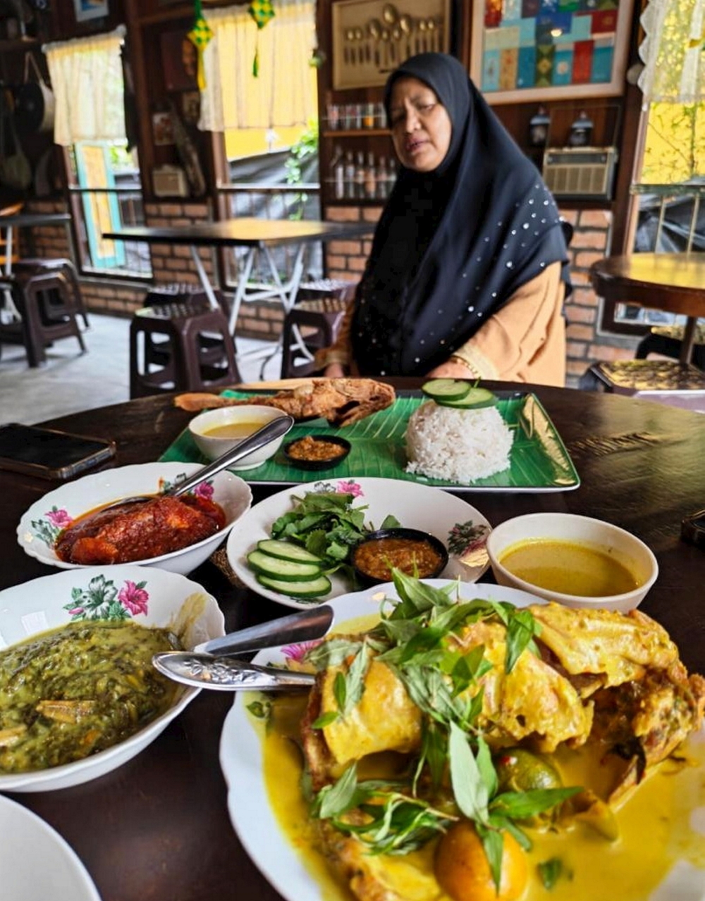 Smoked baung fish cooked in ‘masak lemak cili api’, a signature Negeri Sembilan dish, is among the main attractions at Warong Nora. — Bernama pic