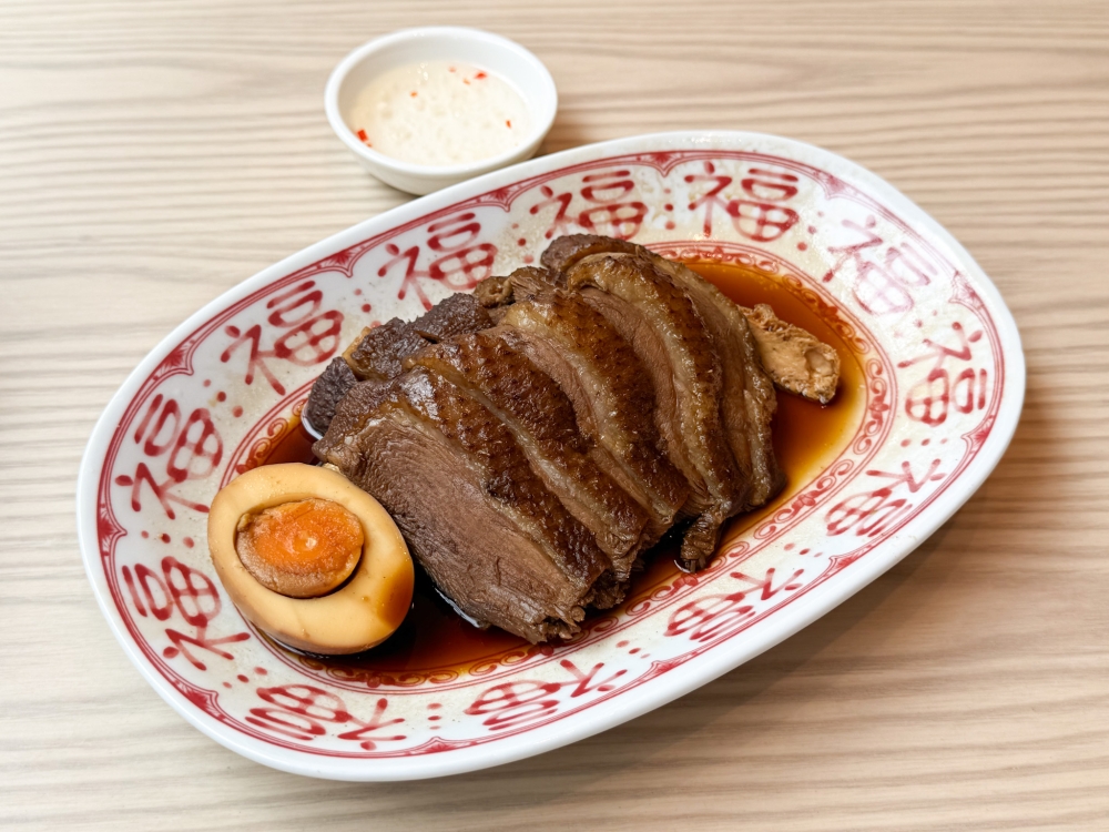 Braised Lion-Head Goose Meat uses a master braising stock of spices and soy sauce. 