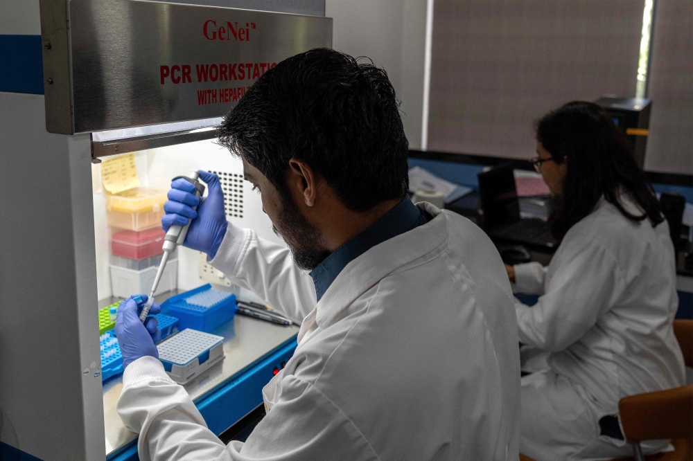 Lab assistants work inside the animal research laboratory at the Vantara Wildlife Rescue and Conservation Centre in Jamnagar September 25, 2026. — AFP pic