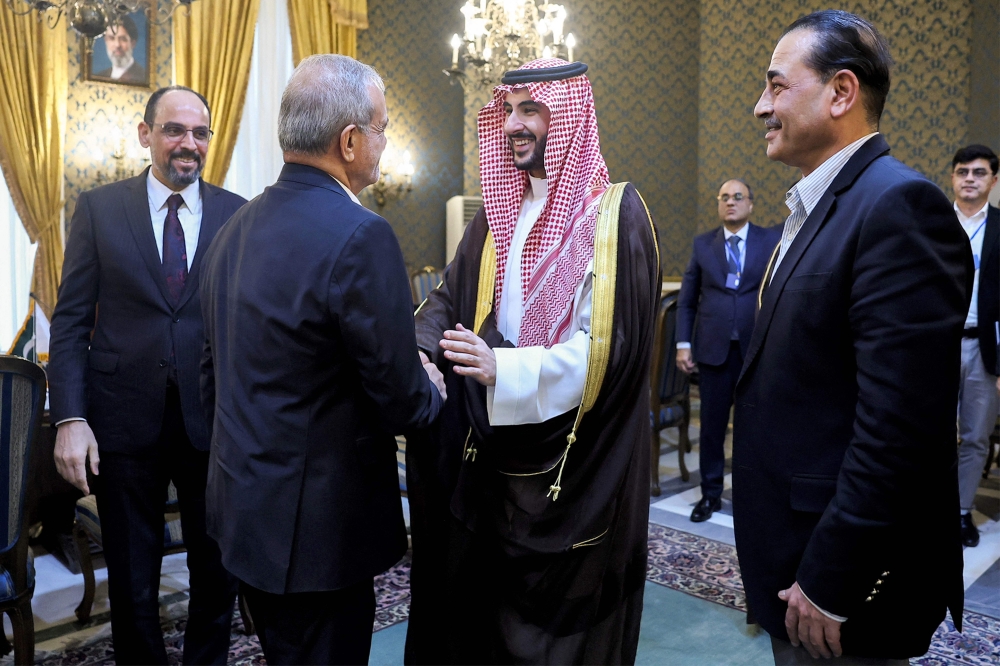 Iran’s President Masoud Pezeshkian (centre, left) shaking hands with Saudi Arabia’s Defence Minister Prince Khalid bin Salman Al-Saud after a meeting with the Pakistani army chief and the Turkish intelligence chief in Tehran on October 26, 2026. Iran began talks on October 26 with the three countries of the Mecca security pact, Pakistan, Saudi Arabia and Turkey, to discuss regional issues as the months-long Middle East war remains locked in a stalemate, state television reported. — Iranian Presidency handout pic via AFP 