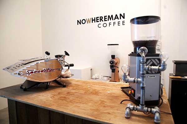 The sparse setup includes a single head Speedster espresso machine and EK43 grinder.