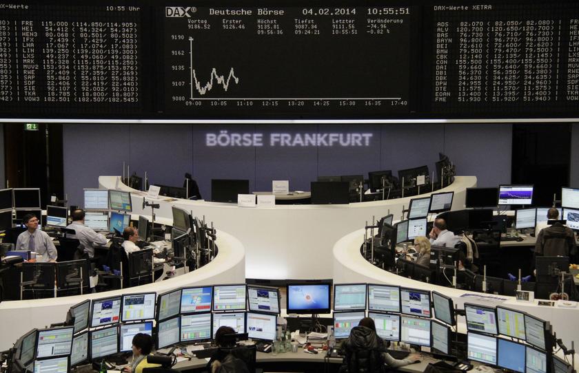 Traders are pictured at their desks in front of the DAX board at the Frankfurt stock exchange February 4, 2014. u00e2u20acu201d Reuters pic