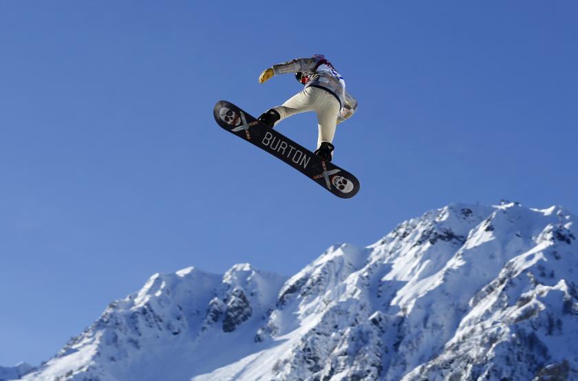 US snowboarder Shaun White goes off a jump during slopestyle snowboard training at the 2014 Sochi Winter Olympics in Rosa Khutor, Russia February 4, 2014.
