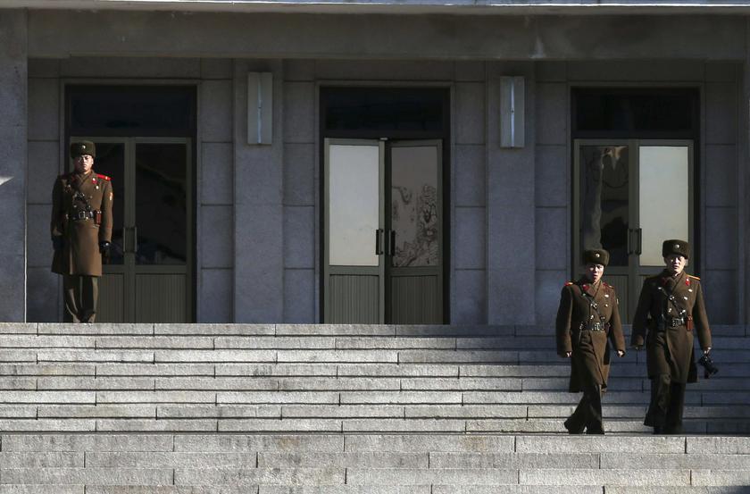 A North Korean soldier (left) stands guard as others patrol at the truce village of Panmunjom in the demilitarised zone (DMZ) separating North Korea from South Korea, about 55 km (34 miles) north of Seoul January 29, 2014. u00e2u20acu201d Reuters pic