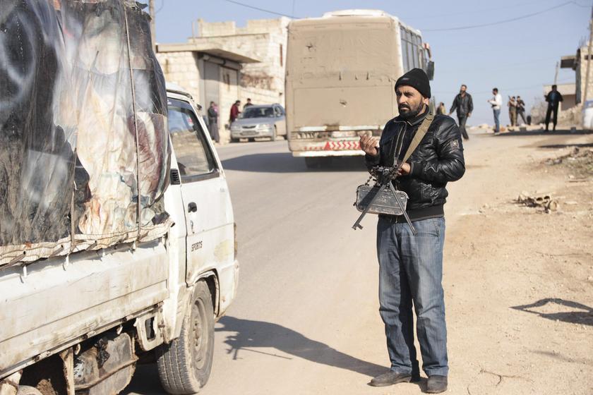 A rebel fighter mans a checkpoint to prevent members of the al Qaeda-affiliated Islamic State of Iraq and the Levant (ISIL) from entering Jabal al-Zawiya in Idlib January 6, 2014.  u00e2u20acu201d Reuters pic