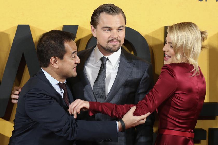 Producer Riza Aziz (left), and cast members Leonardo DiCaprio and Margot Robbie arrive for the UK premiere of u00e2u20acu02dcThe Wolf of Wall Streetu00e2u20acu2122 at Leicester Square, London January 10, 2014. u00e2u20acu201d Reuters pic