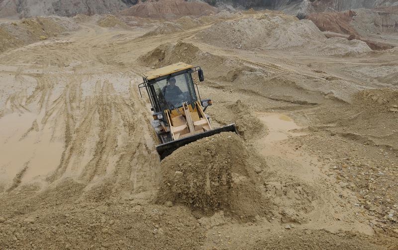 A labourer operates a bulldozer at a site of a rare earth metals mine at Nancheng county, Jiangxi province March 14, 2012. u00e2u20acu201d Reuters pic