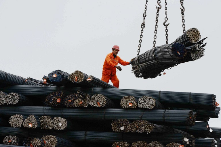 A labourer working in a steel factory in Qingdao, east China's Shandong province, June 15, 2013. u00e2u20acu201d AFP pic
