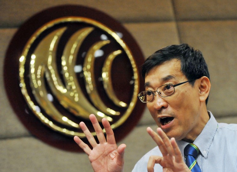 Yu Hsiao-cheng, vice chairperson of Taiwan's telecom regulator National Communications Commission, unveils a list of seven local companies to bid for up to seven 4G operation licenses at a press conference in Taipei on July 1, 2013. u00e2u20acu201d AFP pic