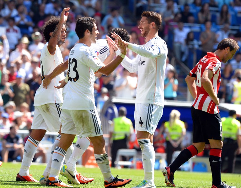 Real Madrid's midfielder Isco (centre) is congratulated by defender Sergio Ramos (right) after scoring during the Spanish league football match Real Madrid vs Athletic Club at the Santiago Bernabeu stadium in Madrid on September 1, 2013. u00e2u20acu201d AFP pic