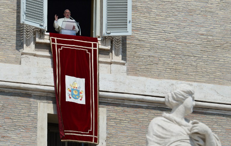 Pope Francis holds on September 1, 2013 his Sunday Angelus prayer from the window of his appartment at the Vatican. u00e2u20acu201d AFP pic