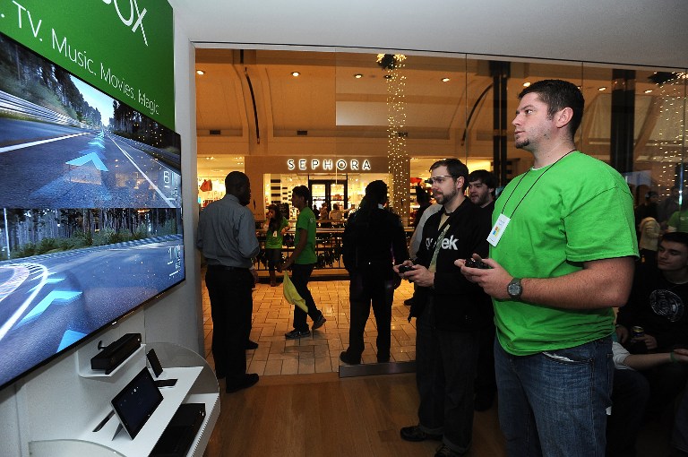 Fans play newly released Xbox One games at the Microsoft retail store at Tysons Corner Centre in McLean, Virginia, November 25, 2013 ― AFP pic