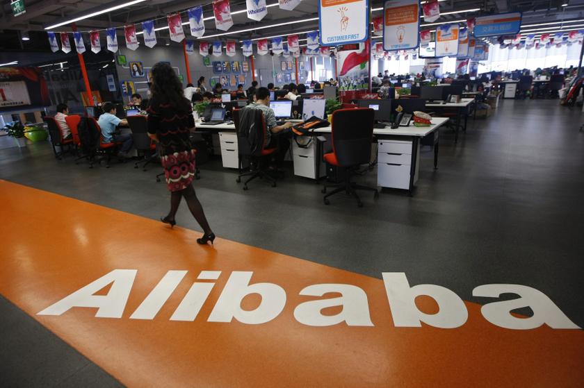 An employee walks past a logo of Alibaba Group at its headquarters on the outskirts of Hangzhou, Zhejiang province, in this May 17, 2010 file photo. u00e2u20acu201d Reuters pic