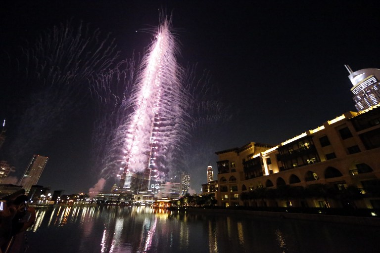 Fireworks illuminate the sky around Dubai's Burj Khalifa, the world's tallest tower, on November 27, 2013, after the Emirati city was chosen to host the World Expo 2020. u00e2u20acu2022 AFP pic