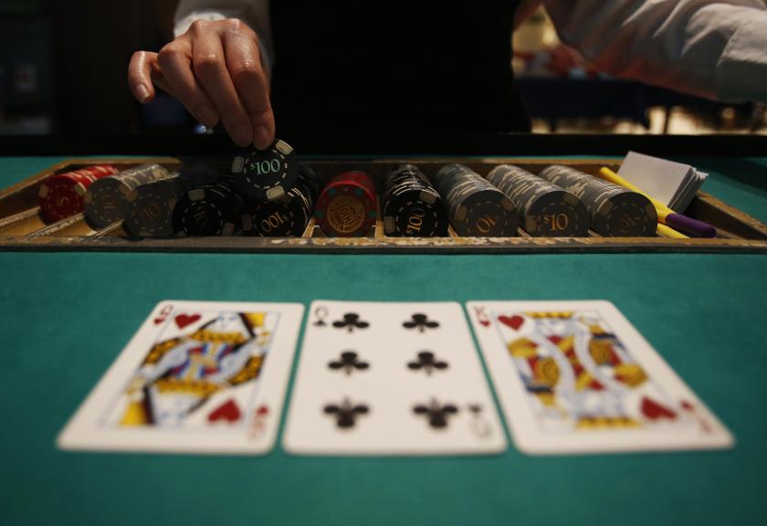 A dealer picks up chips on a mock black jack casino table during a photo opportunity at an international tourism promotion symposium in Tokyo September 28, 2013. u00e2u20acu2022 Reuters pic