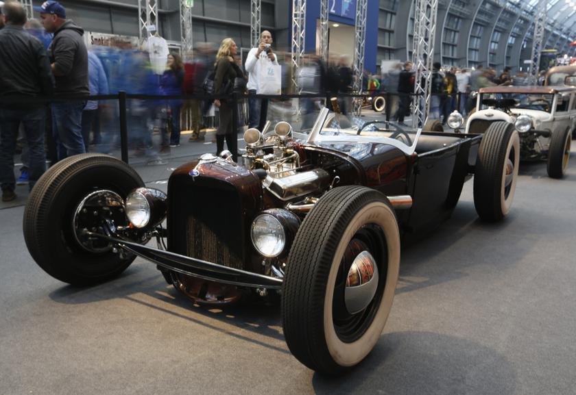 Visitors walk past a hot rod car based on a vintage Ford at the Essen Motor Show in Essen December 1, 2013. u00e2u20acu201d Reuters pic