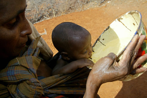 A mother gives water to her child in drought-stricken Wajir District. A government project aims to bring potable water to 1 million district residents by next July. - AFP pic