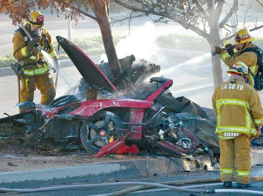 Firefighters extinguish the fire in the car where actor Paul Walker was killed along with another unidentified man during a car crash in Valencia, Santa Clarita, California, November 30, 2013. u00e2u20acu201d Reuters pic