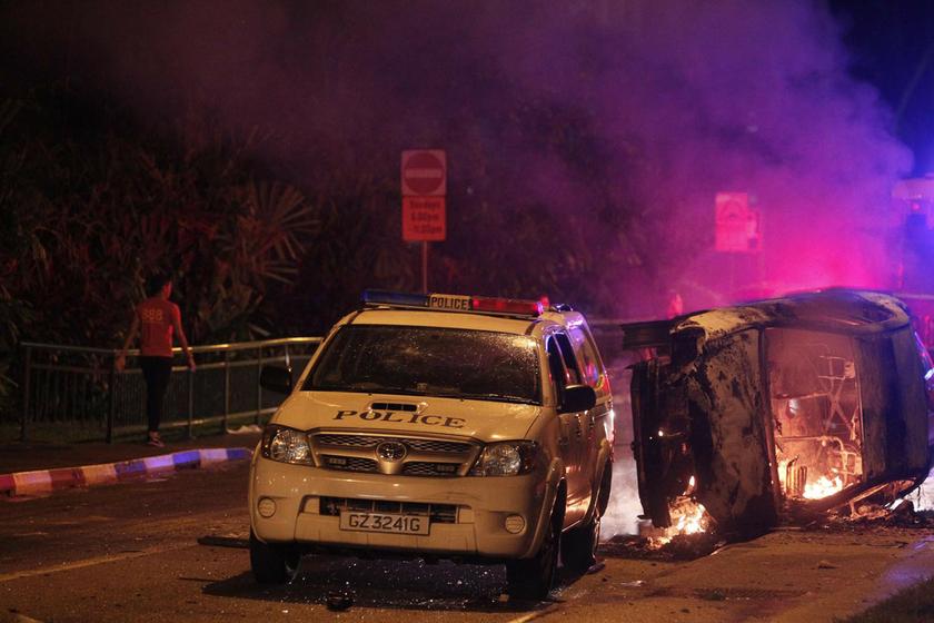 A view shows damaged vehicles along a road after a riot in Singapore's Little India district. December 9, 2013.u00e2u20acu2022 Reuters pic 