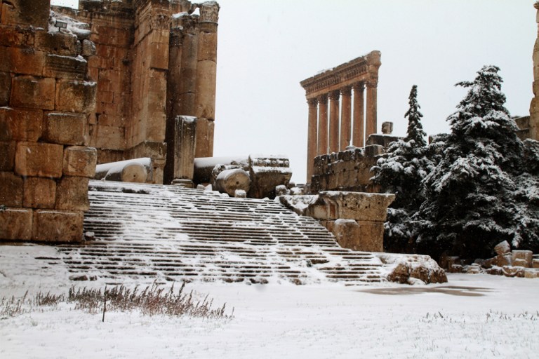 Baalbek's temples are pictured on December 11, 2013 as the Roman ruins of the historic town in eastern Lebanon's Bekaa Valley were covered with snow, following a fierce storm. u00e2u20acu201d AFP pic