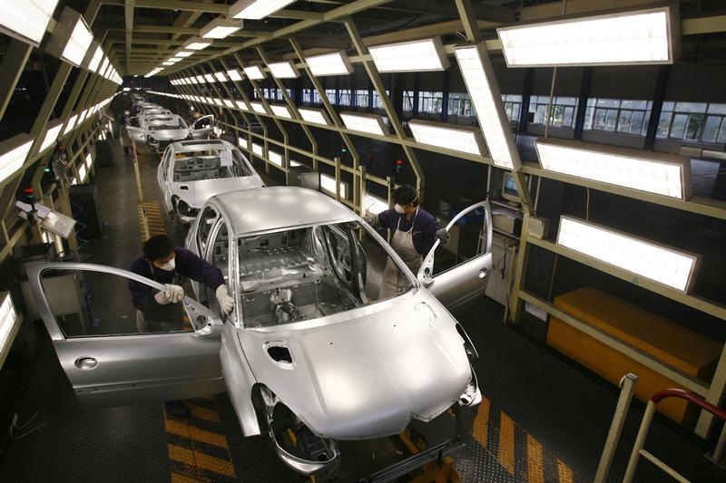Peugeot employees work on the assembly line at the Dongfeng PSA Peugeot Citroen factory in Wuhan, capital of central China's Hubei province, November 17, 2006. u00e2u20acu201d Reuters pic