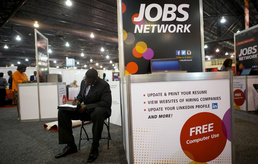 A job-seeker completes an application at a career fair in Philadelphia in this July 25, 2013, file photo. Last Friday's employment report for December may have thrown cold water on upbeat economic sentiment, but the outlook for business investment is good