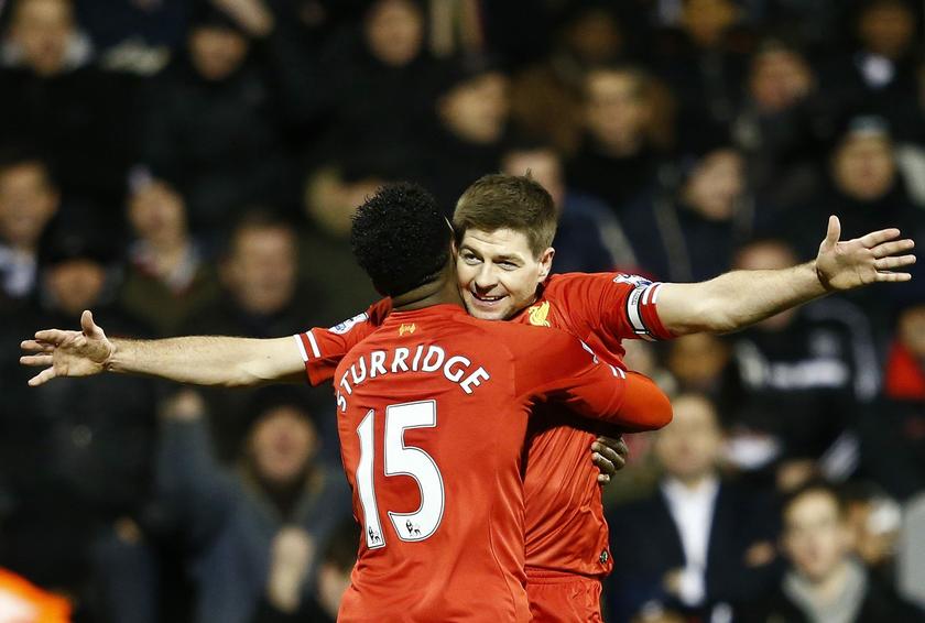 Liverpool's Daniel Sturridge (left) embraces team mate Steven Gerrard after scoring a goal against Fulham during their English Premier League football match atCraven Cottage in London February 12, 2014. u00e2u20acu201d Reuters