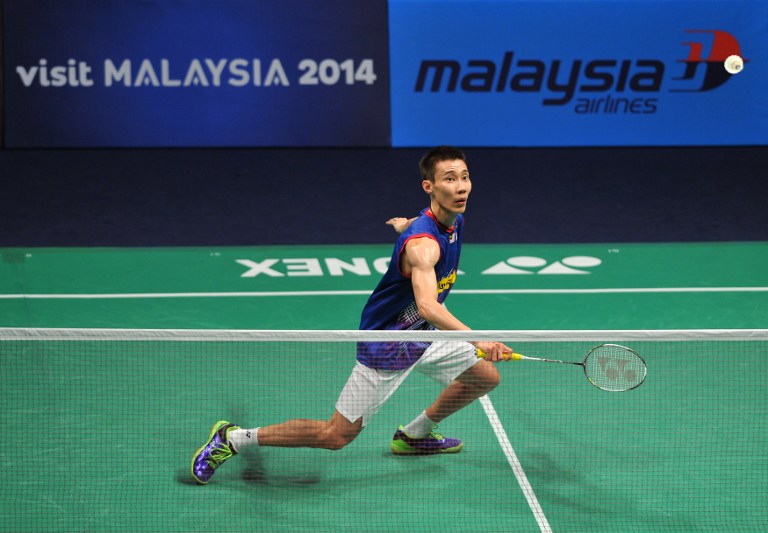 Lee Chong Wei hits a return against Jan O Jorgensen of Denmark during their men's singles match at the BWF badminton World Superseries Finals in Kuala Lumpur on December 13, 2013. Lee beat Jorgensen 23-22, 24-22. u00e2u20acu201d AFP pic