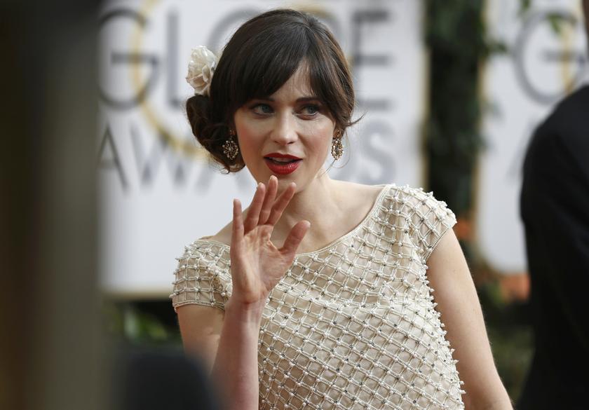 Actress Zooey Deschanel, from the sitcom u00e2u20acu02dcNew Girl,u00e2u20acu2122 waves as she arrives at the 71st annual Golden Globe Awards in Beverly Hills, California, January 13, 2014. u00e2u20acu2022 Reuters pic   