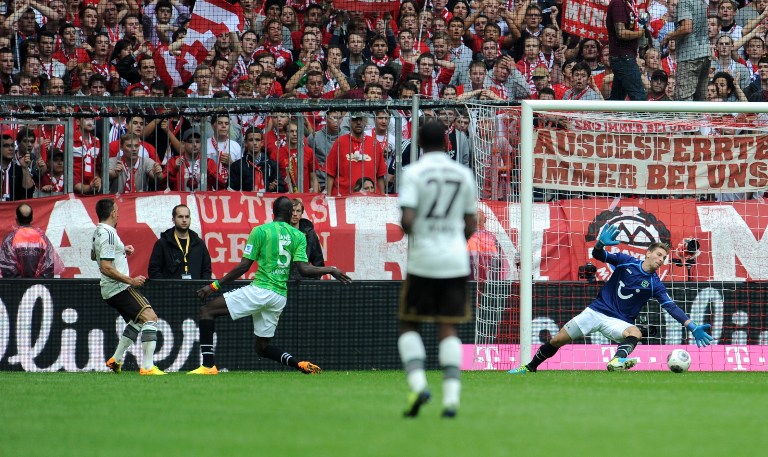 Hanover's goalkeeper Ron-Robert Zieler (right) dives for the ball as Bayern Munich's French midfielder Franck Ribery (left) scores the 2-0 during the German first division Bundesliga football match, southern Germany, on September 14, 2013. u00e2u20acu201d AFP pic