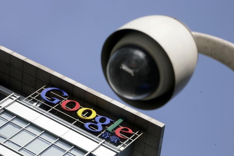 The Google logo is seen on the top of its China headquarters building behind a road surveillance camera in Beijing January 26, 2010. u00e2u20acu201d Reuters pic