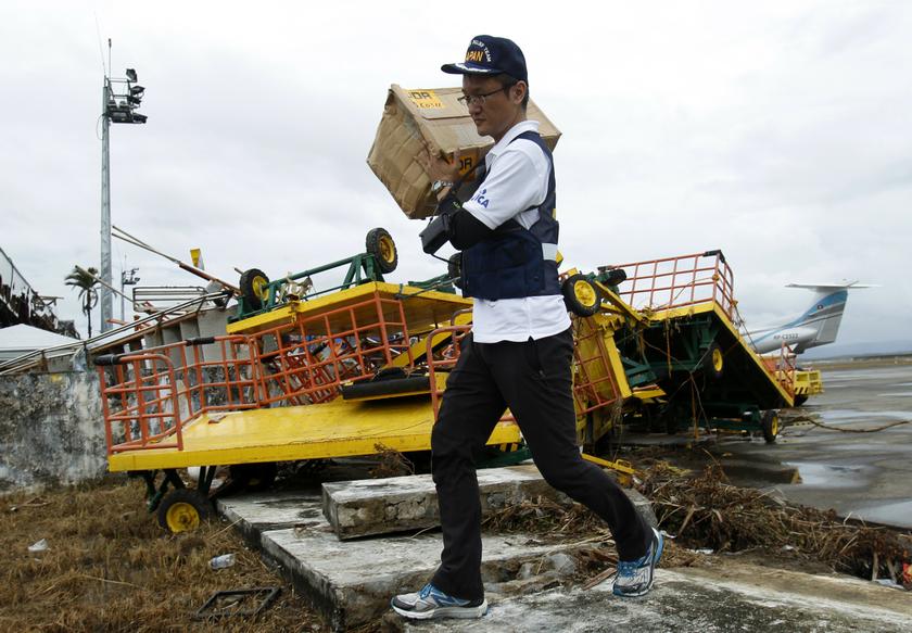 A member of Japan's Disaster Relief Team moves supplies upon arriving at the destroyed airport after Typhoon Haiyan battered Tacloban city in central PhilippinesNovember 12, 2013. u00e2u20acu201d Reuters pic