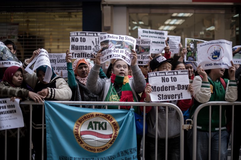 Maids and rights activists protest over allegations of an Indonesian maid being abused in Hong Kong on January 16, 2014. u00e2u20acu201d AFP pic